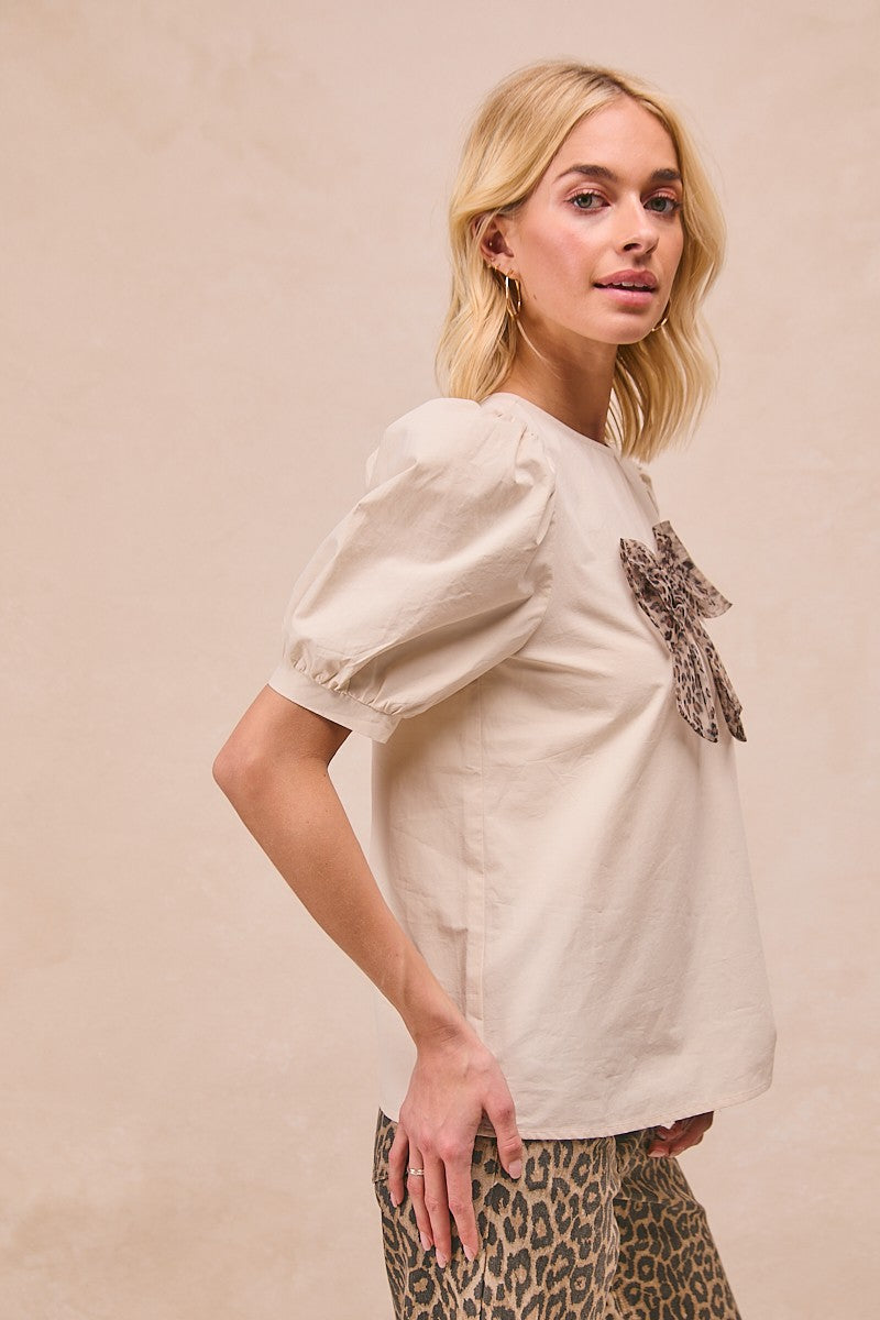 BiBi Solid Color Woven Top with Mesh Leopard Bow Front in Cream