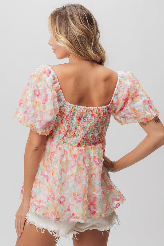 BiBi Multi Colored Flower Peplum Top in Coral/Apricot