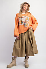 Easel Terry Knit Top with Front Flower Patch in Persimmon