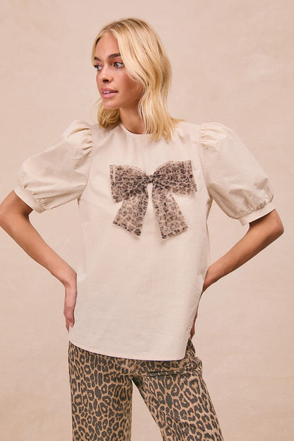 BiBi Solid Color Woven Top with Mesh Leopard Bow Front in Cream