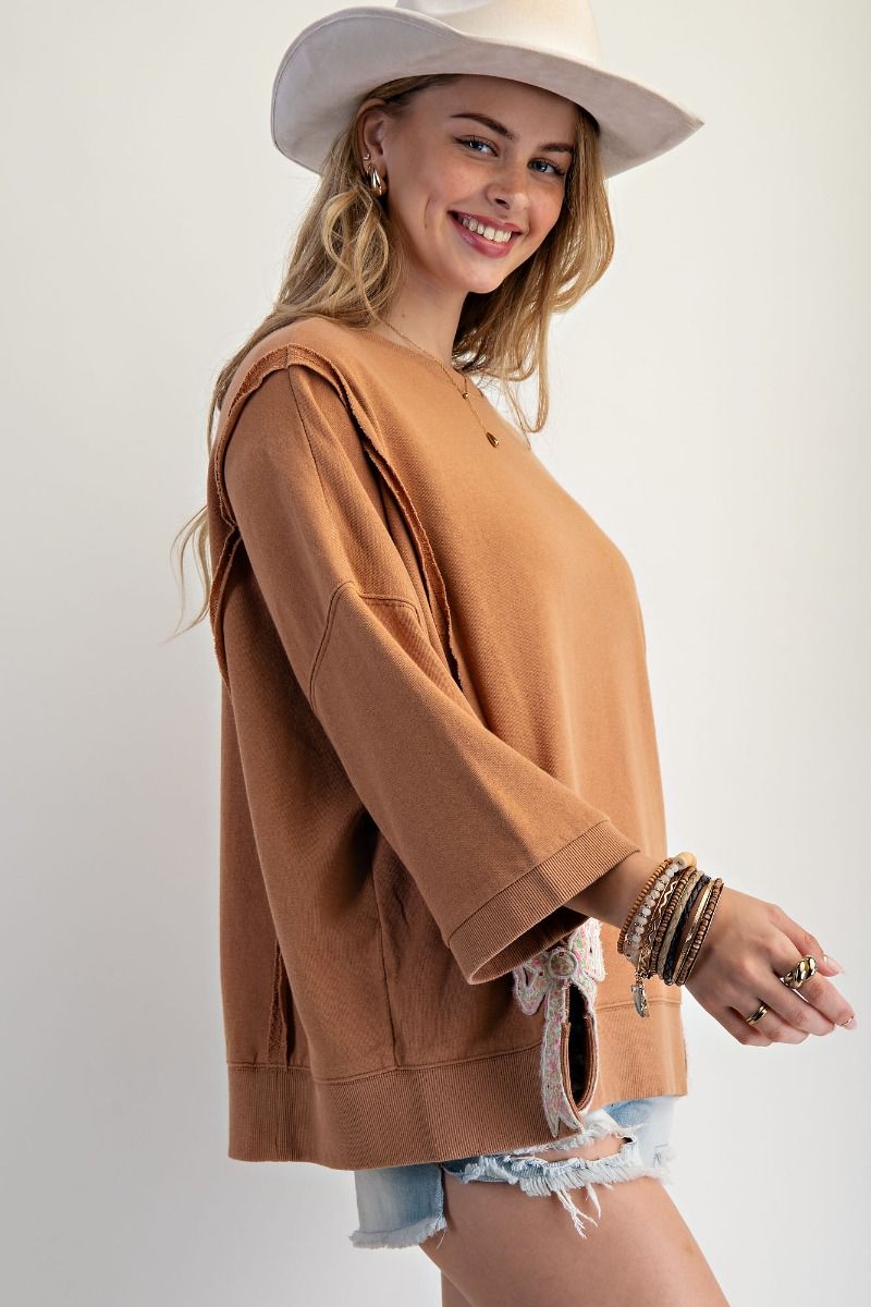 Easel Solid Color Terry Knit Top with Applique Bows on Hem in Camel